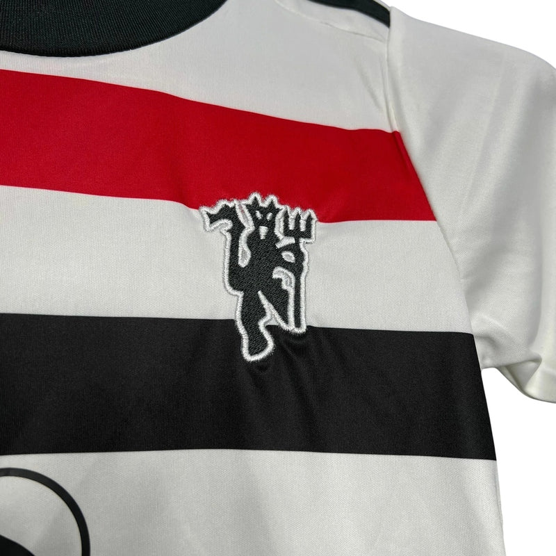 MANCHESTER UNITED III 24/25 CONJUNTO INFANTIL